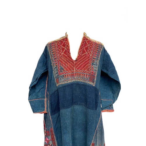 771 - A late 19th/early 20th century Palestinian ladies Thobe dress, indigo dyed cotton with red geometric... 