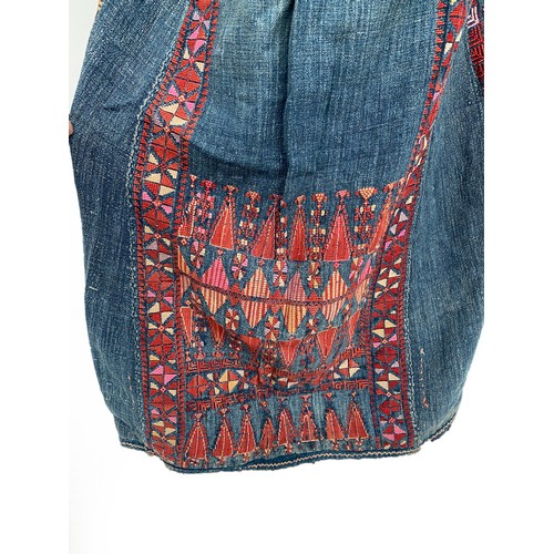 771 - A late 19th/early 20th century Palestinian ladies Thobe dress, indigo dyed cotton with red geometric... 