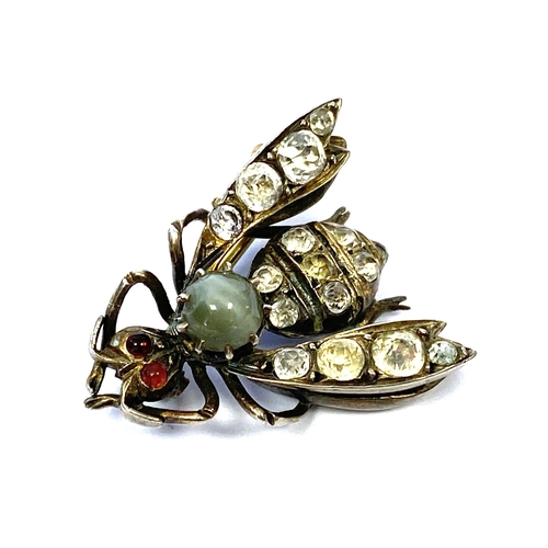 A Victorian silver brooch in the form of a bee set with a cats eye chrysoberyl thorax and paste set wings and abdomen, 2.8cmL, 9g