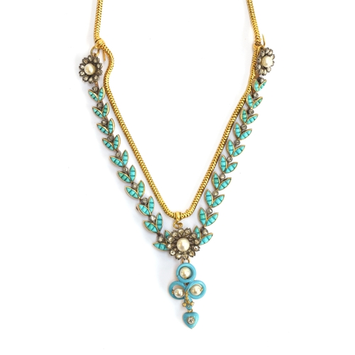41 - A Victorian gold necklace, the snake chain suspending swags of channel set turquoise leaves interspe... 