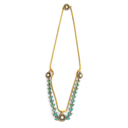 41 - A Victorian gold necklace, the snake chain suspending swags of channel set turquoise leaves interspe... 