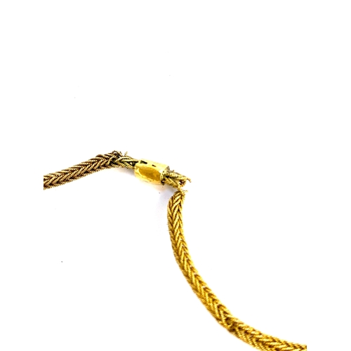 81 - An Ethiopian gold mesh chain with barrel clasp, tests as 14ct or higher, 13g gross weight