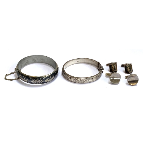 95 - A Thai silver niello bangle together with cufflinks; a silver bangle with floral engraving, hallmark... 