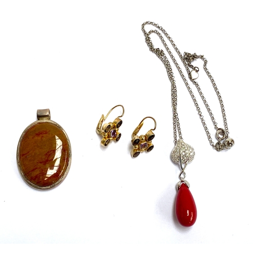 100 - A 925 silver CZ and red drop pendant on chain; amethyst and smoky quartz 925 silver gilt earrings; a... 