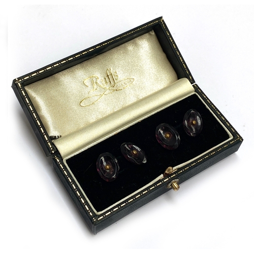 103 - A pair of faceted amethyst and gilt metal cufflinks, each link 1.5cmL, in a Ruffs box