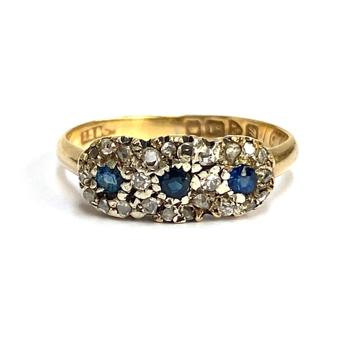 An early 20th century 18ct gold, old cut diamond and sapphire trilogy ring, hallmarked for Chester 1920, size Q 1/2, gross weight 2.7g