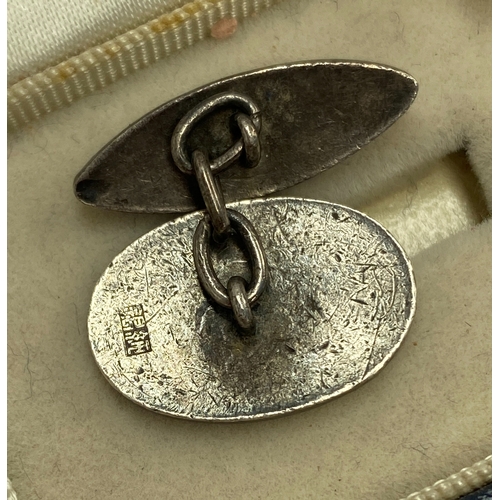 68 - A pair of silver and champleve enamel cufflinks, blue and white design, Chinese hallmarks, in a Kiki... 