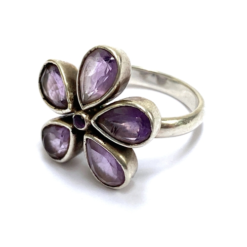 89 - A white metal and amethyst floral cluster ring, size N, 5.5g