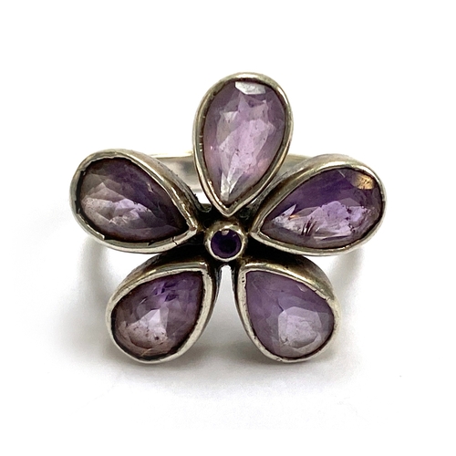 89 - A white metal and amethyst floral cluster ring, size N, 5.5g