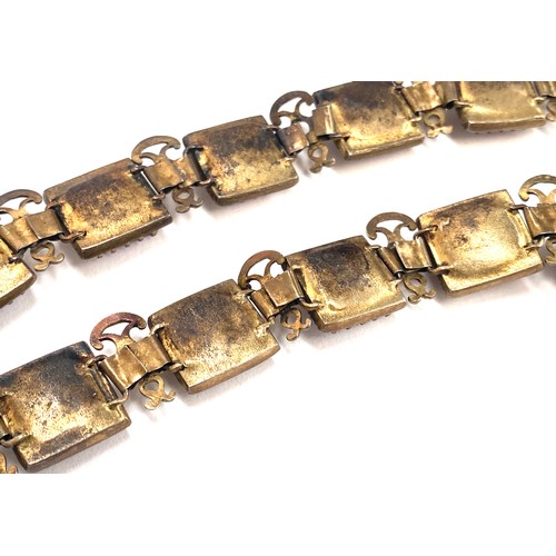 97 - A pair of late 19th/early 20th century gilded white metal bracelets set with amethyst paste, each 17... 