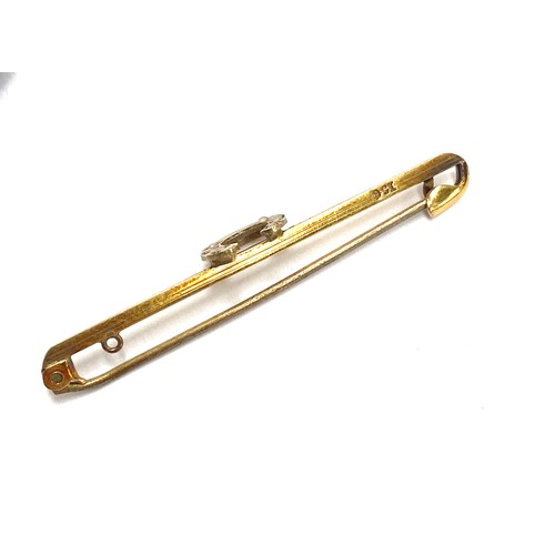 70 - An 9ct gold horseshoe bar brooch set with seed pearls, 2g