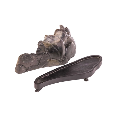 652 - A Chinese carved hardstone boulder group of Lu Dongbin surrounded by attendants, a pagoda in a mount... 