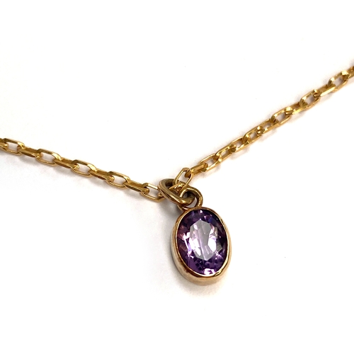 53 - A 9ct gold mounted amethyst pendant in bezel setting, 9cmL, on a 9ct gold chain, 40cmL unclasped, 4.... 