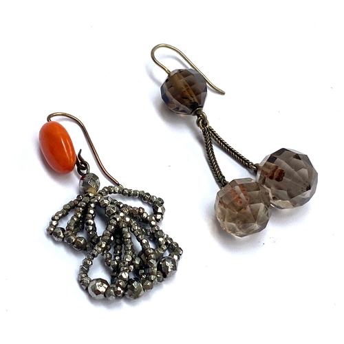 27 - Two single earrings: a 19th century cut steel and coral hook earring; and a smoky quartz and silver ... 