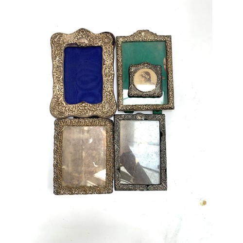 685 - Three early 20th century silver photo frames (all af), together with two silver plated frames, the s... 