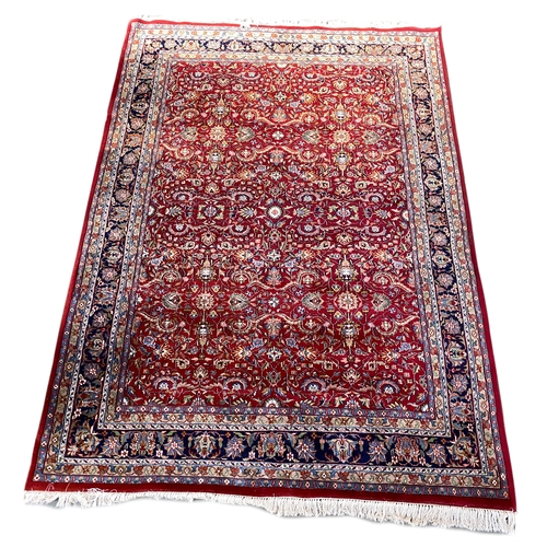 577 - A large Persian Kashan wool carpet, 323x223cm