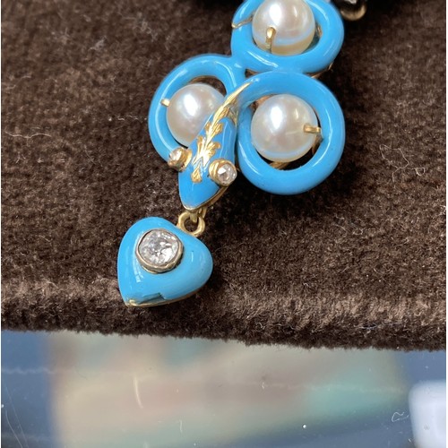 41 - A Victorian gold necklace, the snake chain suspending swags of channel set turquoise leaves interspe... 