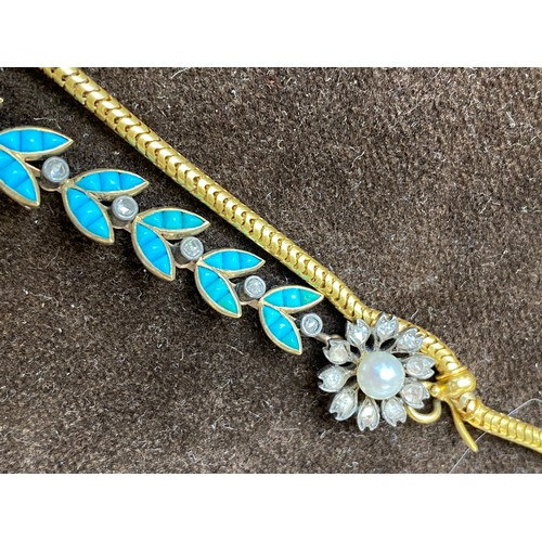 41 - A Victorian gold necklace, the snake chain suspending swags of channel set turquoise leaves interspe... 