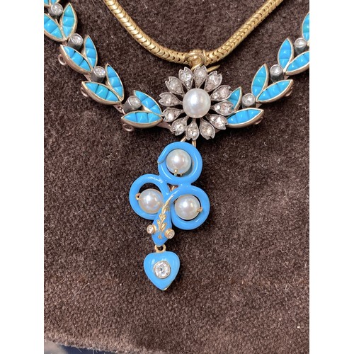 41 - A Victorian gold necklace, the snake chain suspending swags of channel set turquoise leaves interspe... 