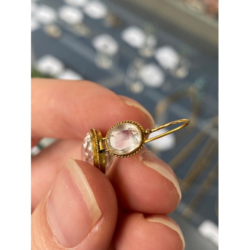 58 - A pair of Victorian gold mounted rock crystal drop earrings, the oval cut rock crystals within a rop... 