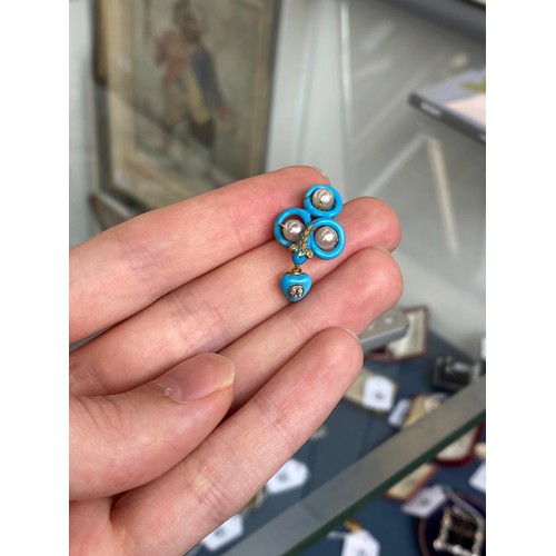 41 - A Victorian gold necklace, the snake chain suspending swags of channel set turquoise leaves interspe... 