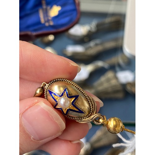 56 - A pair of gold Victorian drop earrings set with a central split pearl within a blue enamelled star, ... 