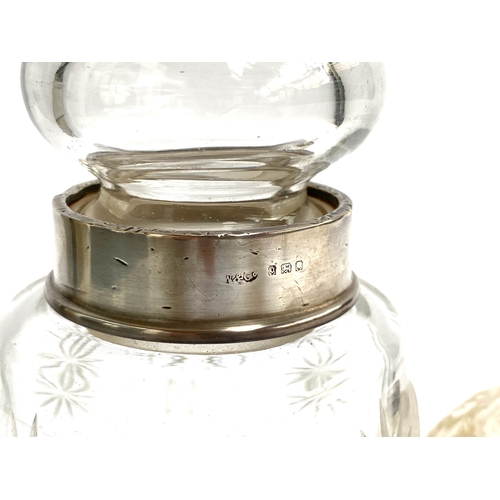 137 - A cut glass jar with silver collar, hallmarked for London 1929, 14.5cmH; together with two small pot... 