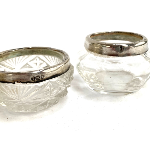137 - A cut glass jar with silver collar, hallmarked for London 1929, 14.5cmH; together with two small pot... 