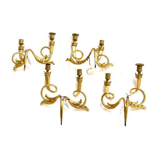 22 - A set of four Louis XV giltwood twin fitting wall sconces with acanthus detail and crenellated bobec... 