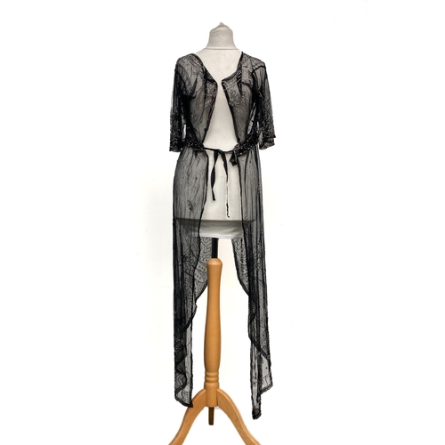 1947 - An early 20th century beaded black lace jacket, with Greek key detail to collar and hem and floral d... 