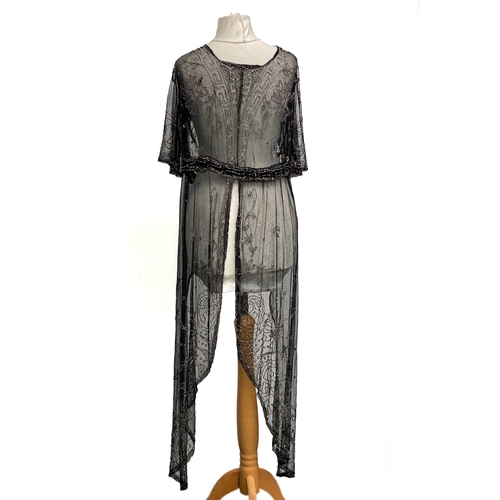 1947 - An early 20th century beaded black lace jacket, with Greek key detail to collar and hem and floral d... 
