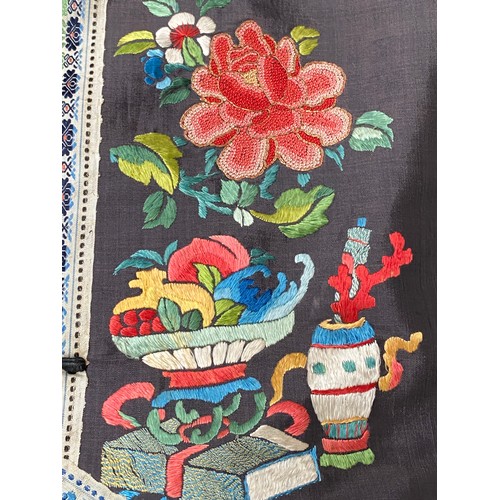 2222 - A late 19th/early 20th century Chinese silk robe, embroidered in satin stitch and Peking knot with p... 