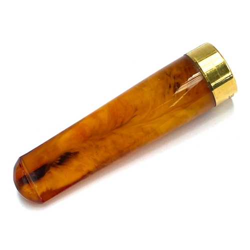2 - An antique amber cheroot holder with 18ct gold plated mount, 6.7cmL, stamped 18ct GP, gross weight 1... 