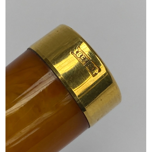 2 - An antique amber cheroot holder with 18ct gold plated mount, 6.7cmL, stamped 18ct GP, gross weight 1... 
