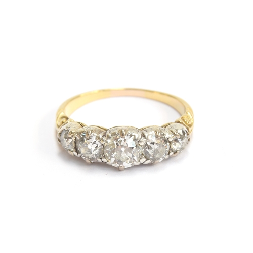 25 - A Victorian 18ct gold and diamond five stone ring, the open backed diamonds in cut down silver colle... 