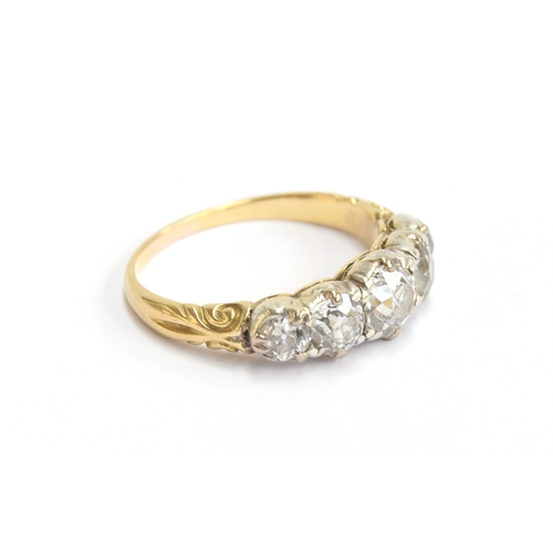 25 - A Victorian 18ct gold and diamond five stone ring, the open backed diamonds in cut down silver colle... 