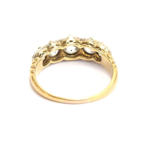 25 - A Victorian 18ct gold and diamond five stone ring, the open backed diamonds in cut down silver colle... 