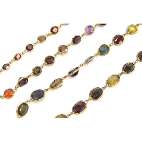 36 - An early 20th century gold mounted multi gem set riviere necklace, the stones in bezel settings, to ... 