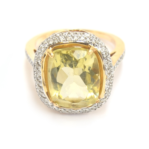 19 - An 18ct gold, diamond and citrine cluster ring, the citrine 12x9.5x6.8mm, size M, 8.2g