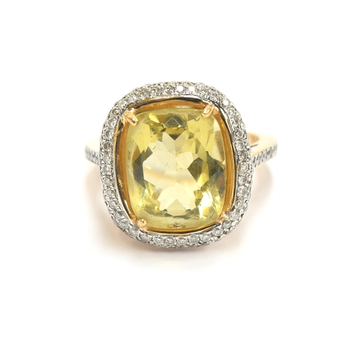 19 - An 18ct gold, diamond and citrine cluster ring, the citrine 12x9.5x6.8mm, size M, 8.2g