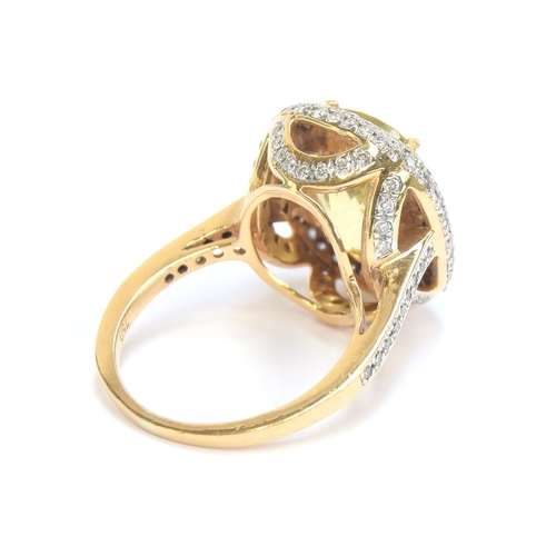 19 - An 18ct gold, diamond and citrine cluster ring, the citrine 12x9.5x6.8mm, size M, 8.2g