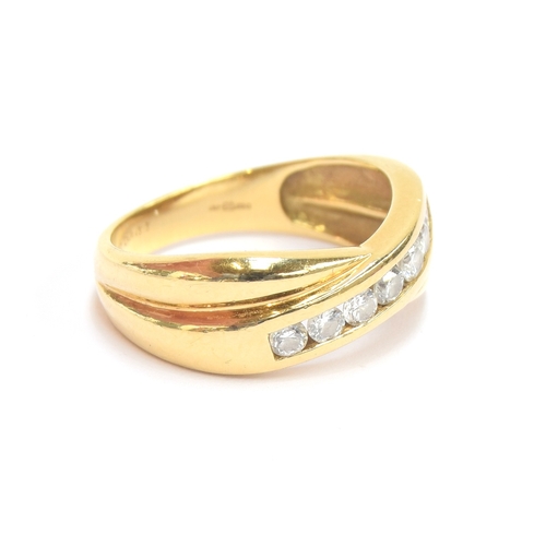 21 - An 18ct gold and diamond crossover ring, size M, 4.5g