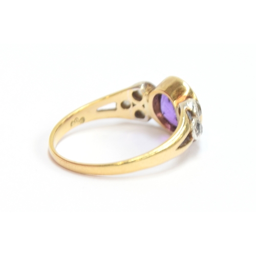 10 - An early 20th century 18ct gold, amethyst and diamond ring, the bezel mounted central stone 8mm wide... 