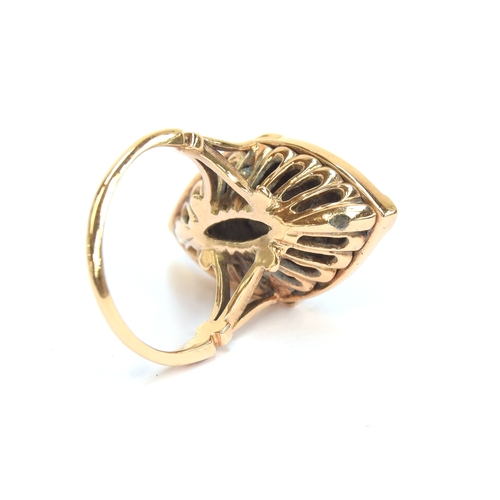 5 - A Georgian Revival gold, enamel and diamond ring of navette form, a diamond set star burst on a coba... 