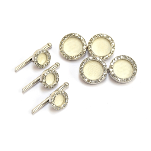 28 - A set of Cartier platinum and diamond cufflinks and studs, each link set with a white biscuit porcel... 
