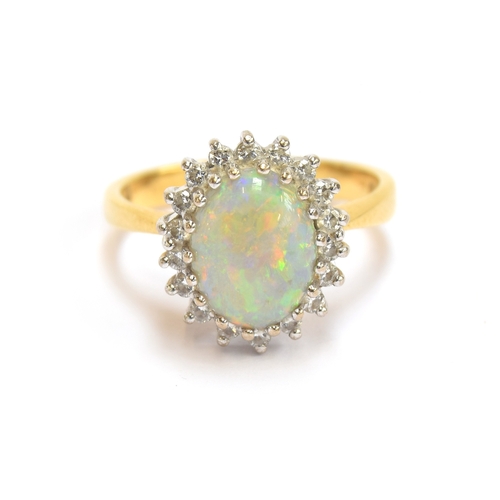 17 - An 18ct yellow gold, opal, and diamond cluster ring, the opal 9x7.5mm, size M, 5.1g