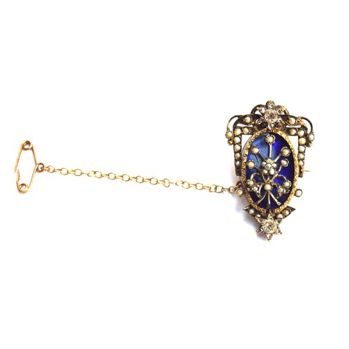 61 - A Victorian gold brooch set with seed pearls in a floral spray on a Bristol blue glass ground, flank... 
