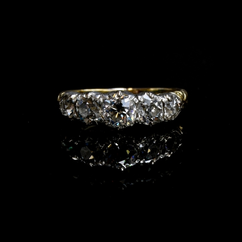 25 - A Victorian 18ct gold and diamond five stone ring, the open backed diamonds in cut down silver colle... 