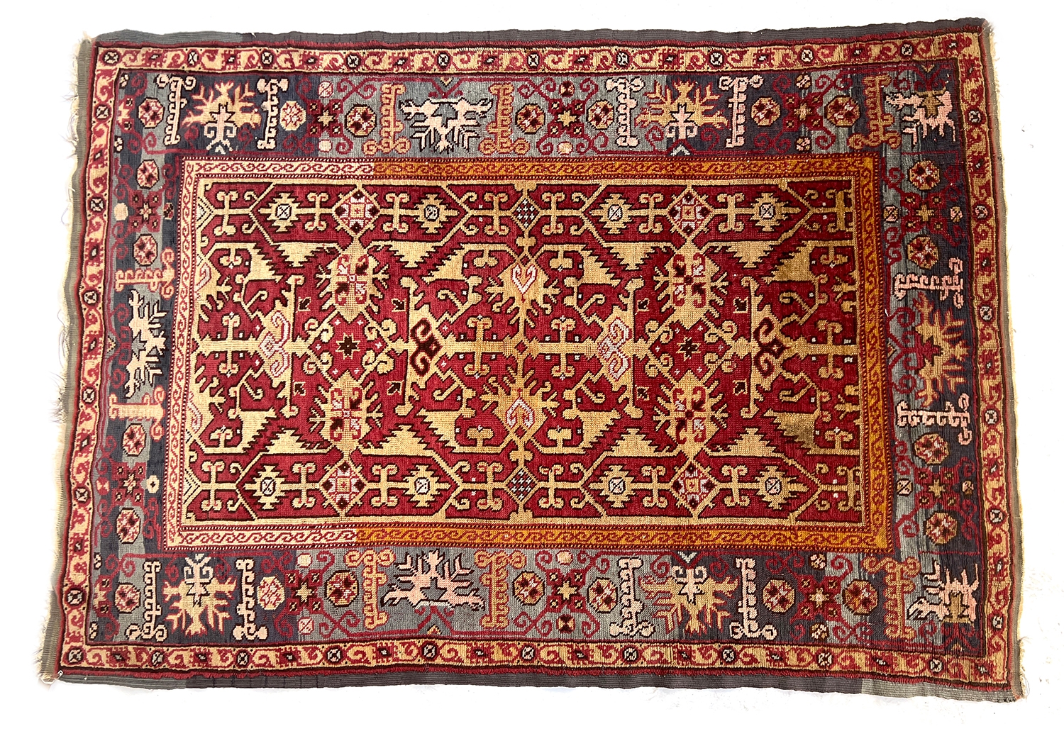 An Oushak 'Lotto' rug, 74x122cm