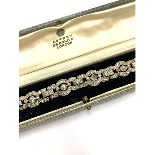 10 - An Art Deco paste set bracelet, 18cmL, in an Asprey Bond Street box
